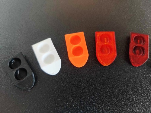 Five test tube feeders in various solid color options (black, white, orange, red, dark red).
