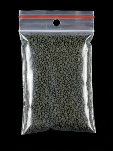 Tropical Super Forte spirulina granulat pro stinky v sacku - cerne pozadi