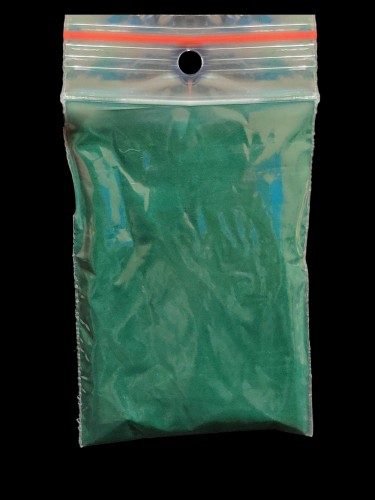 Pure spirulina powder for isopods in a zip-lock bag - black background