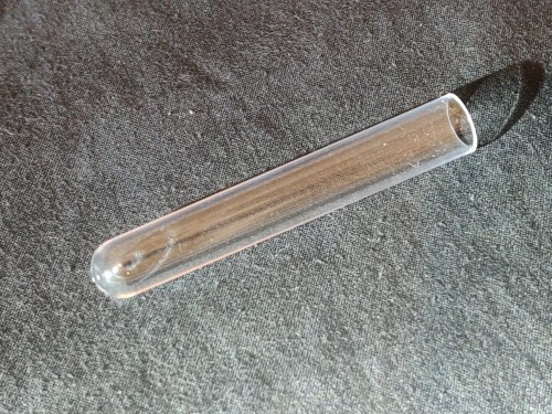 Transparent PS plastic 16x100mm test tube on a black background.